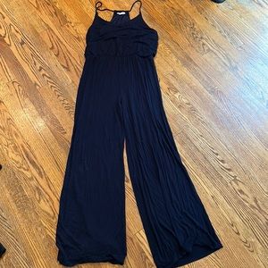 “Rolla coster” Large navy blue jumpsuit with flared leg.
